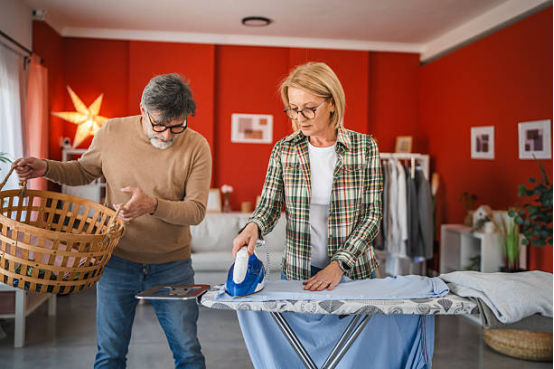 Ironing a festive tablecloth on an ironing board for perfect decoration