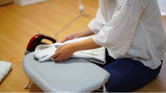 Highly efficient ironing techniques are recommended for housewives, to be used in conjunction with an ironing board. 1 Ironing board with clean fabric and steam setup
