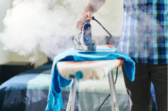 Vacuum coordination between steam system and ironing board