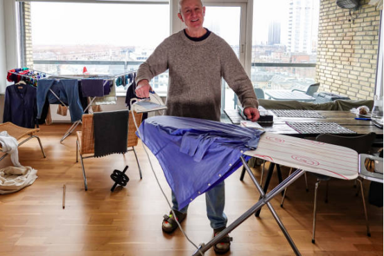 family members sharing tasks around an ironing board