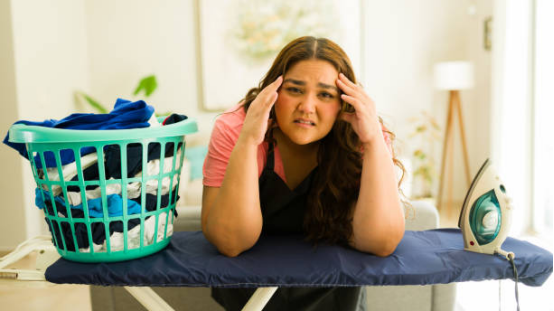 Why do many people dislike ironing boards? 2 User unfolding and preparing ironing board effortlessly